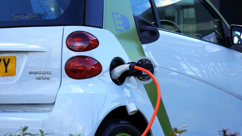 Close-up of CCS charging connector plugged into an electric vehicle
