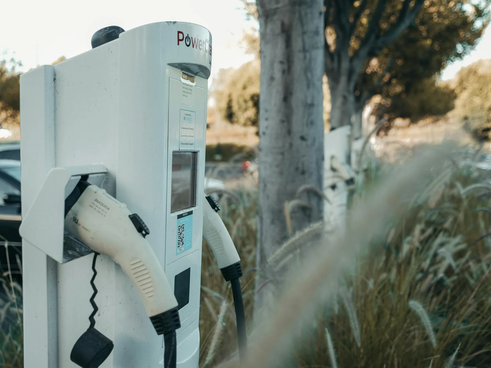 Electric vehicle charging station in outdoor commercial setting